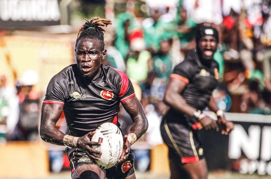 Rugby players in action during an outdoor sports competition.