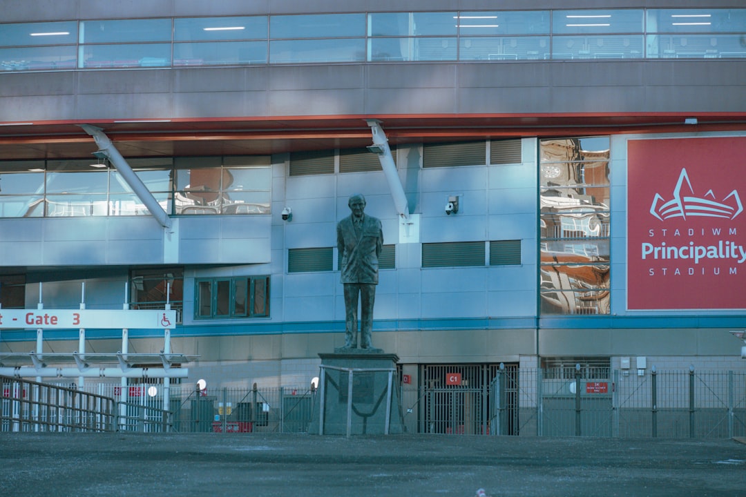 a large building with a statue in front of it